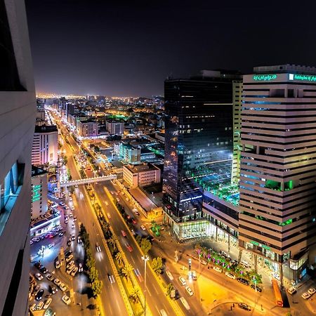 Holiday Suites Al Azizia Mecca Exterior photo The city of Karachi at night.